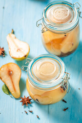 Homemade pickled pears in vinegar with cloves.