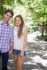 Obraz premium Bonding couple, portrait or holding hands in park, nature or garden walk on valentines day date, romance love or summer break. Smile, happy man or woman in relax trust, partnership or safety support