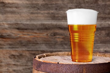 Pint glass of beer in bar on the desk