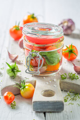 Homemade pickled tomatoes made of homegrown tomatoes.