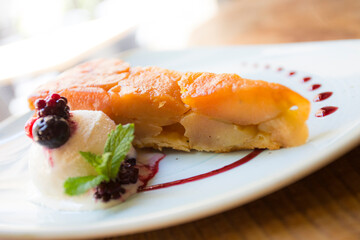Tarte Tatin is a variant of apple pie in which the apples have been caramelized in butter and sugar before being incorporated into the dough.