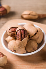 pecan nuts on wooden table