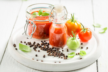 Healthy passata prepared from tomatoes. Preserved vegetables for the winter.