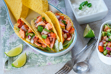 Grilled salmon tacos with avocado salsa