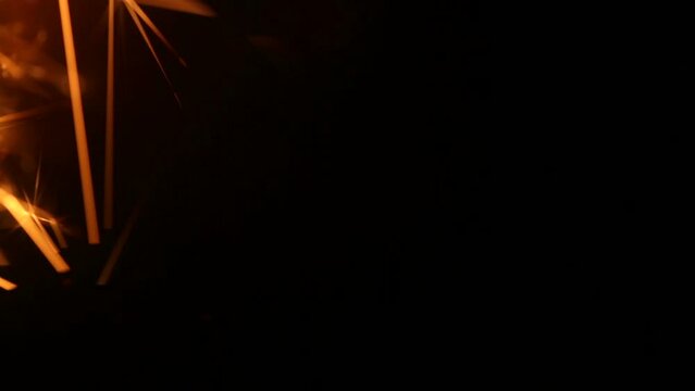 Firework sparkler burning in macro shot
