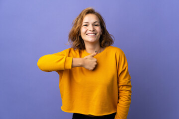 Young Georgian woman isolated on purple background giving a thumbs up gesture