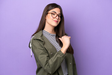 Young Brazilian woman isolated on purple background proud and self-satisfied