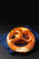 Food concept Homemade Soft Pretzels on black background with copy space