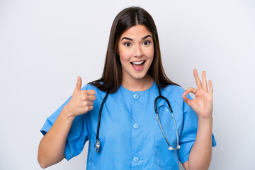 Young Brazilian nurse woman isolated on white background showing ok sign and thumb up gesture