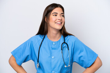 Young Brazilian nurse woman isolated on white background posing with arms at hip and smiling