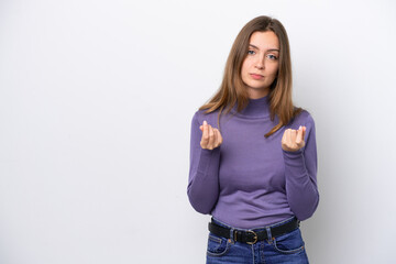 Young caucasian woman isolated on white background making money gesture but is ruined