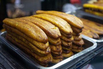 Honey bananas are famous in the old Tangerang market. served with milk chocolate and grated cheese on top.