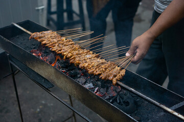 Chicken satay at the old market in Tangerang. Chicken satay is made from chicken and peanut sauce grilled over hot charcoal.