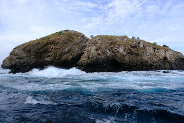 Indonesia Sumbawa - Small island in rough sea