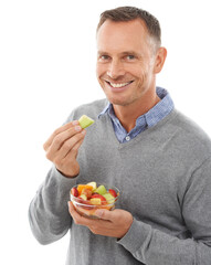 Happy man with fruit salad isolated on a white background for healthy green lunch, diet choice or...