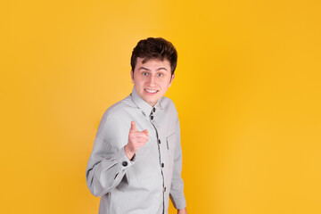 A Handsome guy on yellow background 