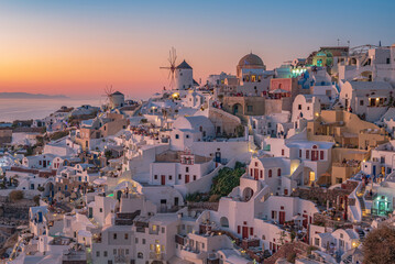 The picturesque village of Oia at dusk, Santorini island GR 