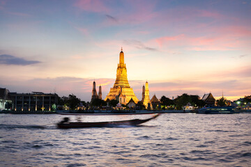 Wat Arun ,lit up after sunset,along the Chao Phraya river,Bangkok,Thailand.