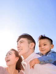 Happy family  standing and looking forward