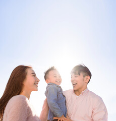 Happy Asian family and kid laughing