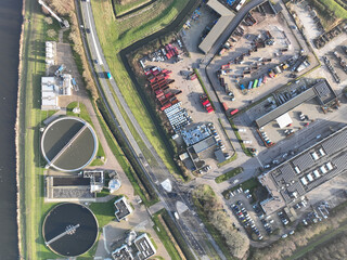 An aerial drone photo offers a unique view of a recycling center facility, showcasing its commitment to sustainability and environmental responsibility through the processing of waste materials.