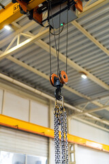 Factory tranportation strong hook. Metal lifting heavy crane .
