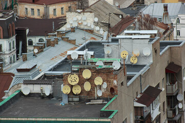 Painted satellite TV and internet dishes on the roofs