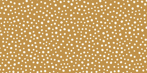 White festive confetti vector polka dot pattern, seamless repeat design. Trendy minimal style on mustard orange background. Great for fabrics, greeting cards, wallpapers, gift wrapping paper