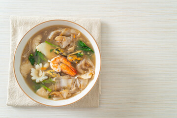 Wide Rice Noodles with Seafood in Gravy Sauce