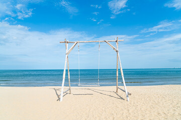 wooden swing on the beach