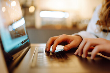 Female hands working on a laptop, close-up. Technology, Freelance, online course, remote work,...