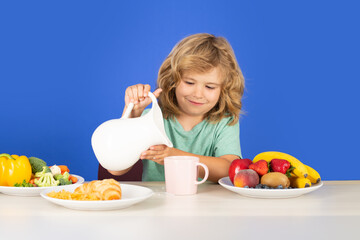 Healthy breakfast for kids. Kid with dairy milk. Cheerful kid keeping healthy diet nutrition, getting calcium, vitamins, probiotics for growth from dairy products.