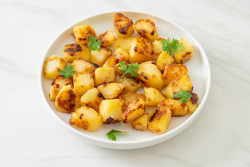 Roasted or grilled potatoes  on plate