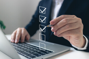 Naklejka na ściany i meble Businessman tick correct mark to approve document iso checklist icon.check quality management with quality assurance or QA and quality control or QC and improvement, Standardization and certification.