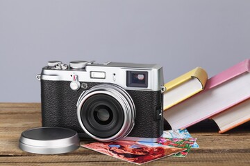 Old fashioned camera on bookshelf with retro books