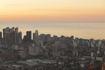 Naklejka na ściany i meble city sunset, evening sunrise, sea view, aerial cityscape with modern architecture