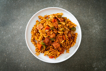fusilli pasta with ham and tomatoes sauce
