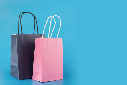 shopping bags on blue background, gift bags, online shopping, sale and discount