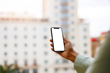 Afro american woman using a smartphone with white screen for mock up design.