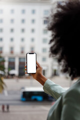 Afro American woman using a smartphone with a white screen for mock-up design. Vertiical