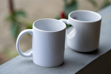Close-Up of a White Ceramic Coffee Mug with a Blurred Background