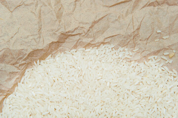 Abstract background with rice grains on crumpled old parchment wrapping paper