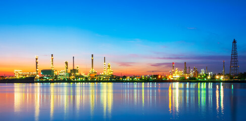 Panorama of oil refinery with reflection, petrochemical plant.Gas refinery beside river.Colorful...