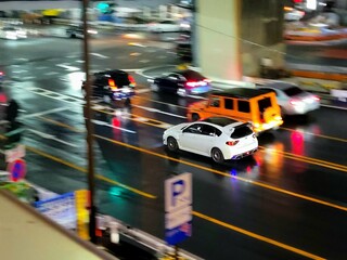 Tokyo, Japan: White Subaru Impreza WRX STI hatchback in Shibuya intersection at night