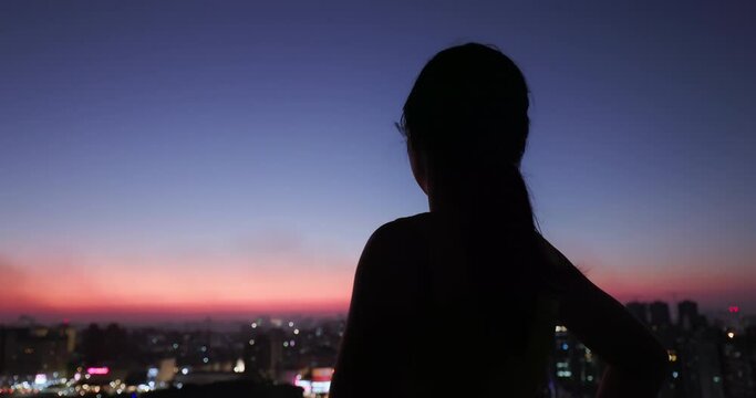 woman with night city view