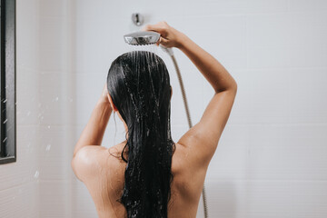 Woman washing hair with shampoo and shower in bathroom, Asian female body and hair care with foam to freshness. Spa and Health care.