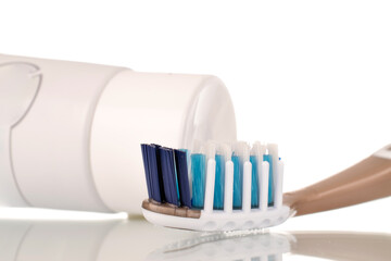 Oral care products, toothpaste and toothbrush, macro isolated on white background.