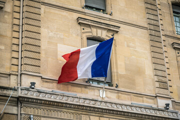 French Flag at Facade of Historic Building in Paris