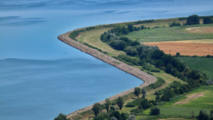 Fototapeta na wymiar A high angle view to the bank of the large pond near Palava hills, Czech republic