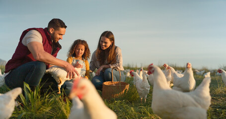 Chicken, farm and family love of happy mom, dad and child enjoy quality time together, talking and...